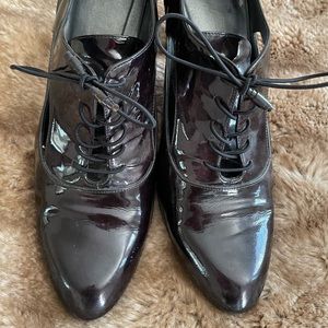 Stuart weitzman patent tie booties